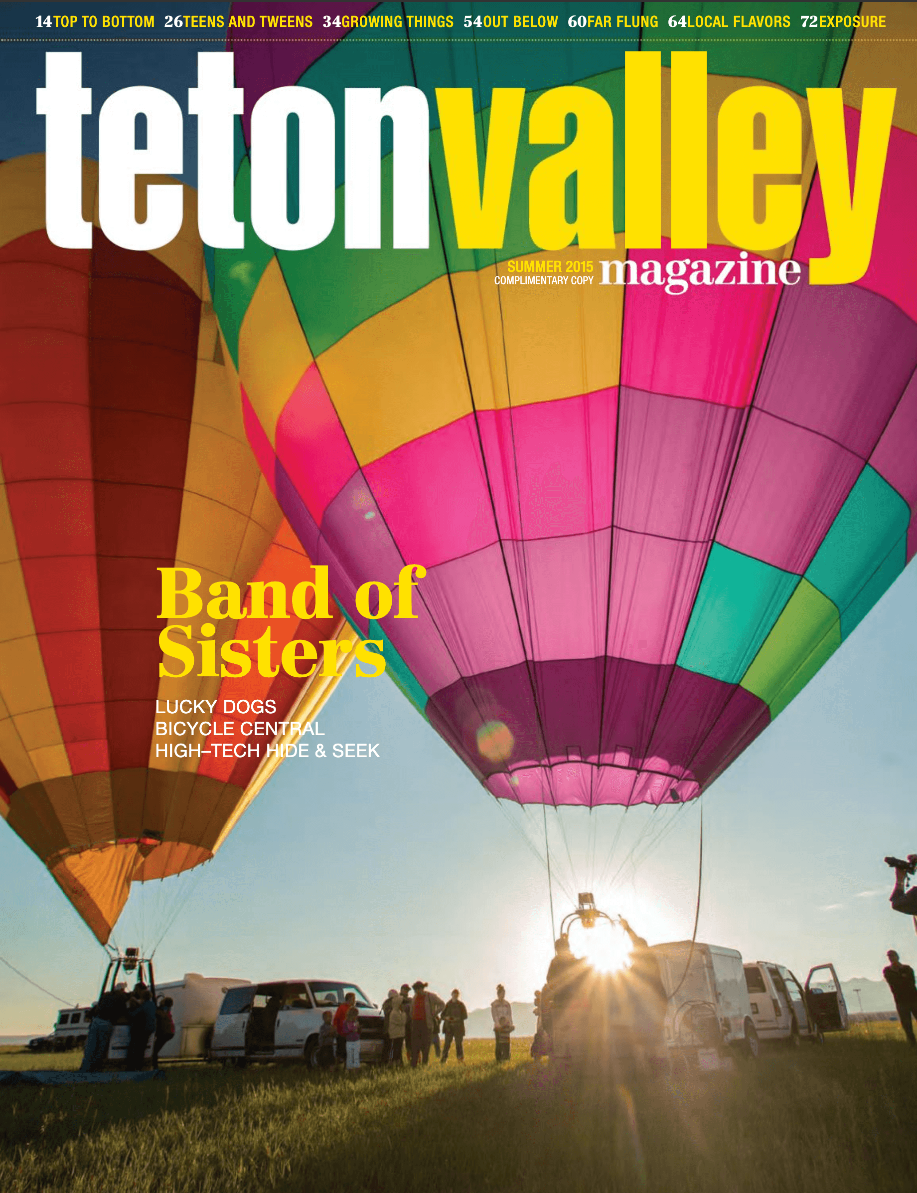 Teton Valley Magazine's Summer 2015 cover isth two hot air balloons in Driggs, Idaho.
